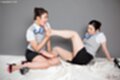 Office lady seated wearing short skirt.girlfriend licking her toes bare feet.jpeg